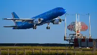 ITA Airways plane in flight at Genoa airport