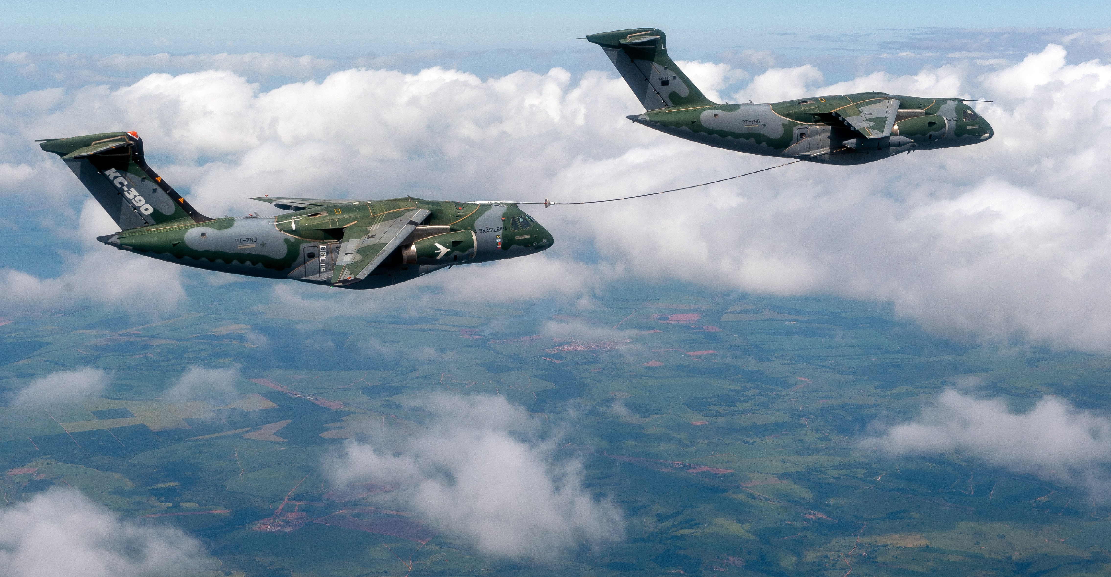 Two KC-390 Millennium aircraft during an aerial refuelling qualification