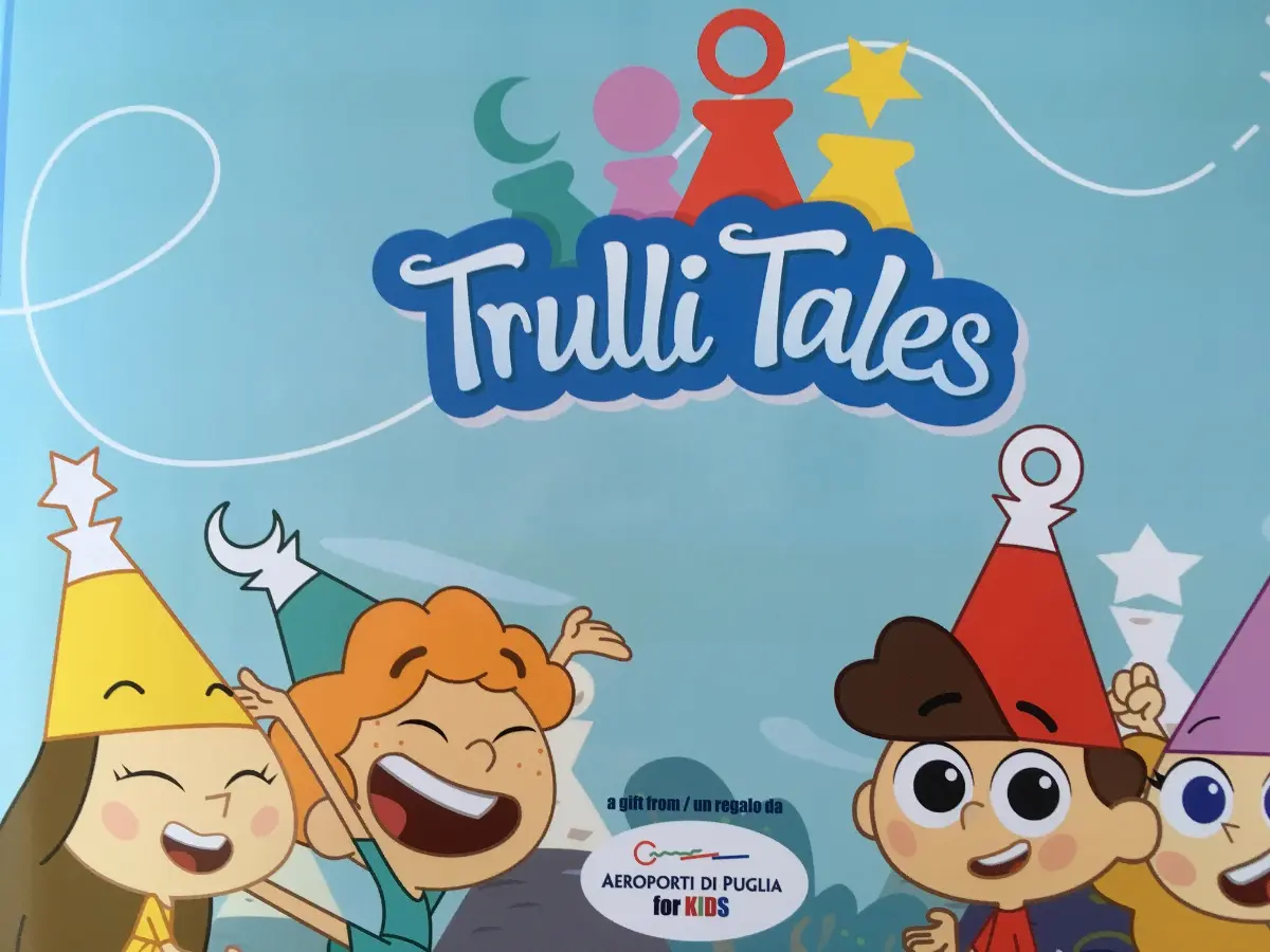 Copertina"Trulli Tales" iniziativa dedicata ai piccoli viaggiatori in partenza dagli aeroporti di Bari e di Brindisi