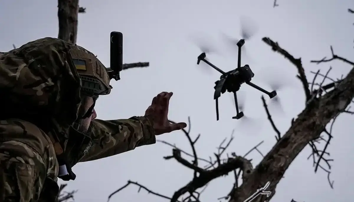 Soldier launches an Ukrainian drone