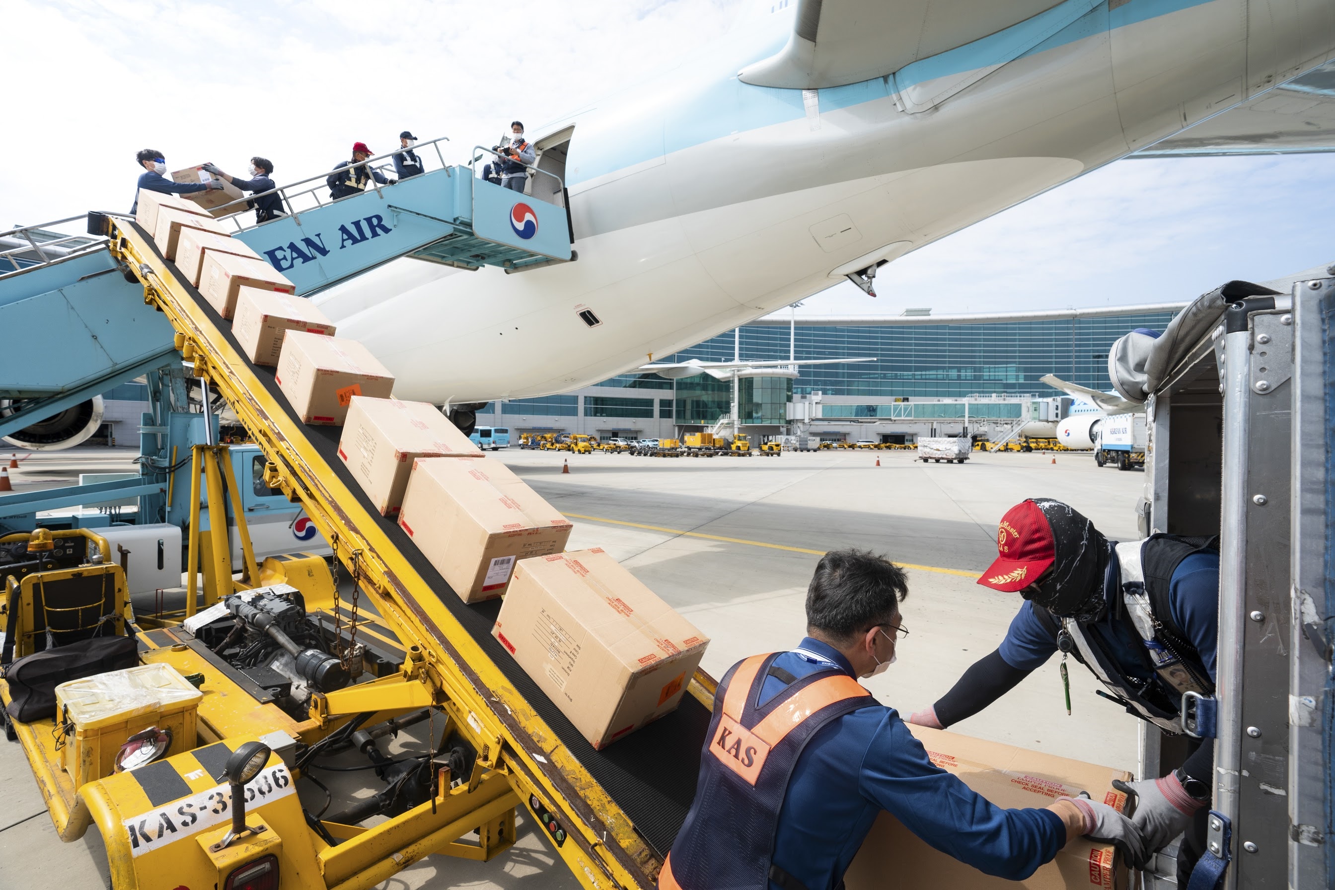 Loading cargo in the cabin of Korean Air's B-777/300ER aircraft converted for cargo operation