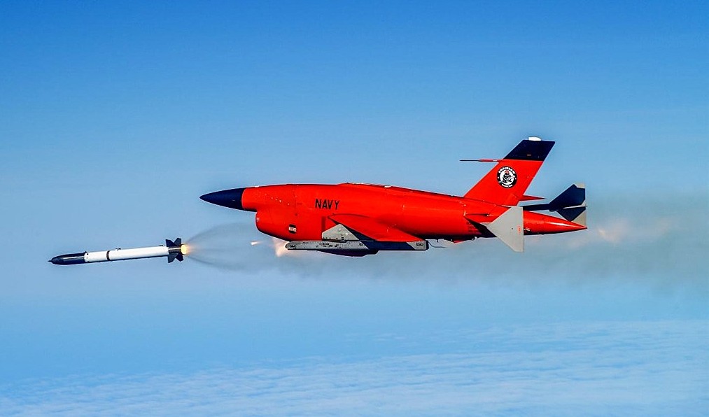 A BQM-34 remotely piloted unmanned aerial target launches a test missile over the Point Mugu Sea Range. The test advanced a missile design aimed at improving range and targeting for future US Navy missions