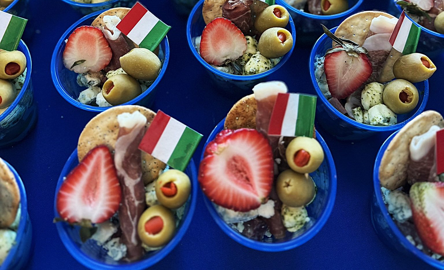 Denver International Airport: celebrations for the first flight of the new route Denver-Rome served from May 1st, 2025 by United Airlines: tri-coloured appetizers on B-787/9 Dreamliner