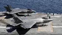 Two F-35C on the flight deck of the USS Abraham Lincoln carrier