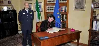 SE monsignor Fabio Dal Cin, arcivescovo di Loreto, mentre firma albo d'onore durante la visita al CenForAvEn, avvenuta il 13 maggio 2019 a Loreto (Ancona)