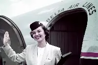 1940. Summer uniform: One of the most elegant uniforms in Delta history created by the Pan American Uniform Company of Miami: short Eisenhower-style jacket, cotton blouse, fitted skirt, and cap designed by Mae Hanauer, New York